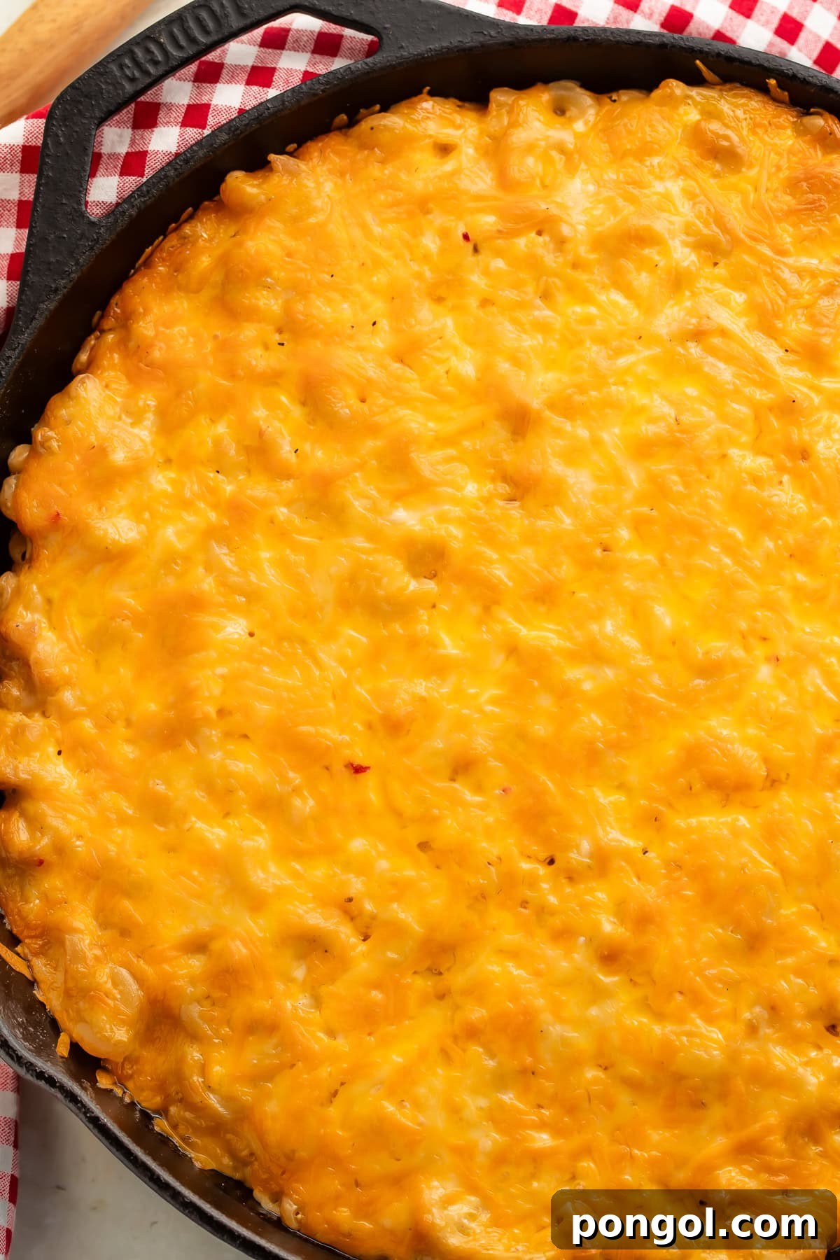 Smoked mac and cheese in a baking dish topped with herbs