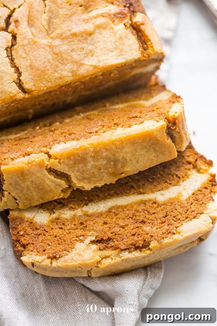 Paleo pumpkin bread with cream cheese swirl sliced