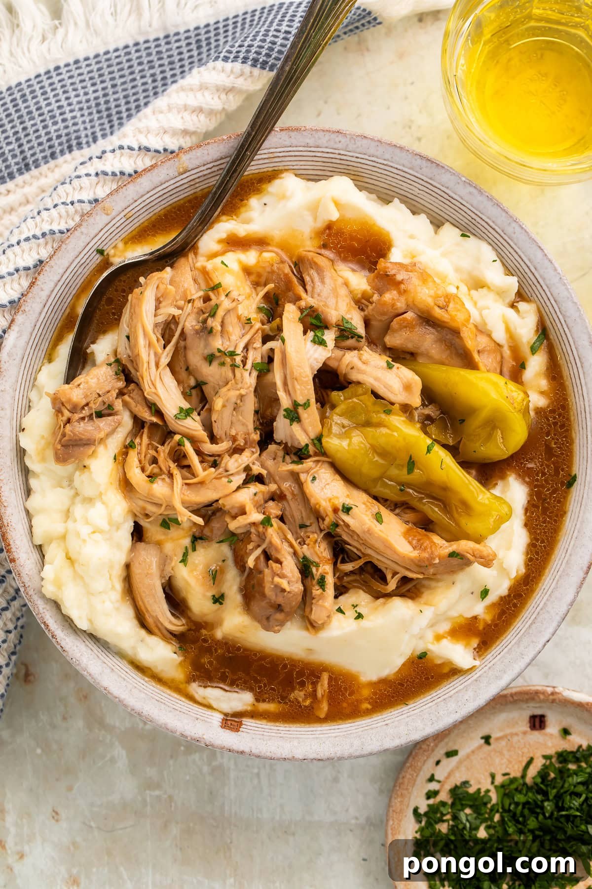 Southern Comfort Chicken Pot Roast 2 Mississippi chicken pot roast served over creamy mashed potatoes with rich gravy and pepperoncini peppers garnished with fresh parsley