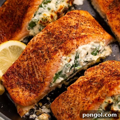 Close-up of stuffed salmon showing creamy spinach and cheese filling