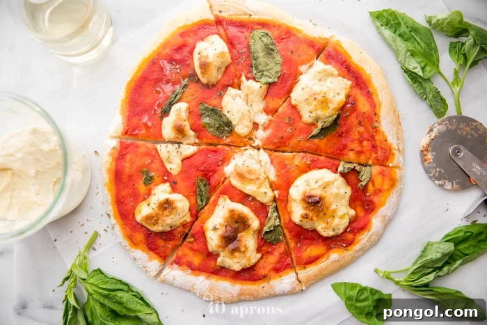 A close-up of a paleo pizza slice, emphasizing the perfect rise and texture of the gluten-free crust