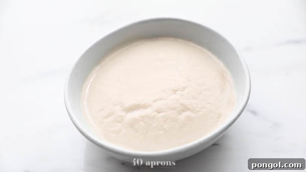 Yeast and honey blooming in warm water for paleo pizza dough