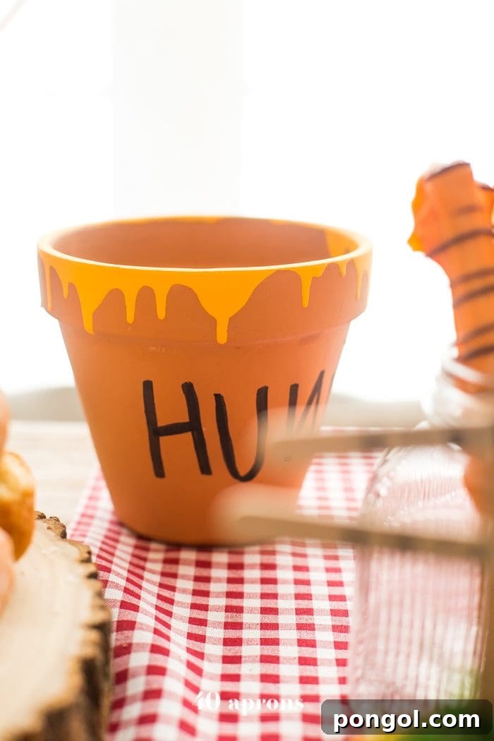 This DIY Winnie the Pooh birthday party is too cute! With tons of Winnie the Pooh birthday party ideas, this is your Winnie the Pooh birthday party guide. Happy birthday, little one! It'd make a great Winnie the Pooh baby shower, too.