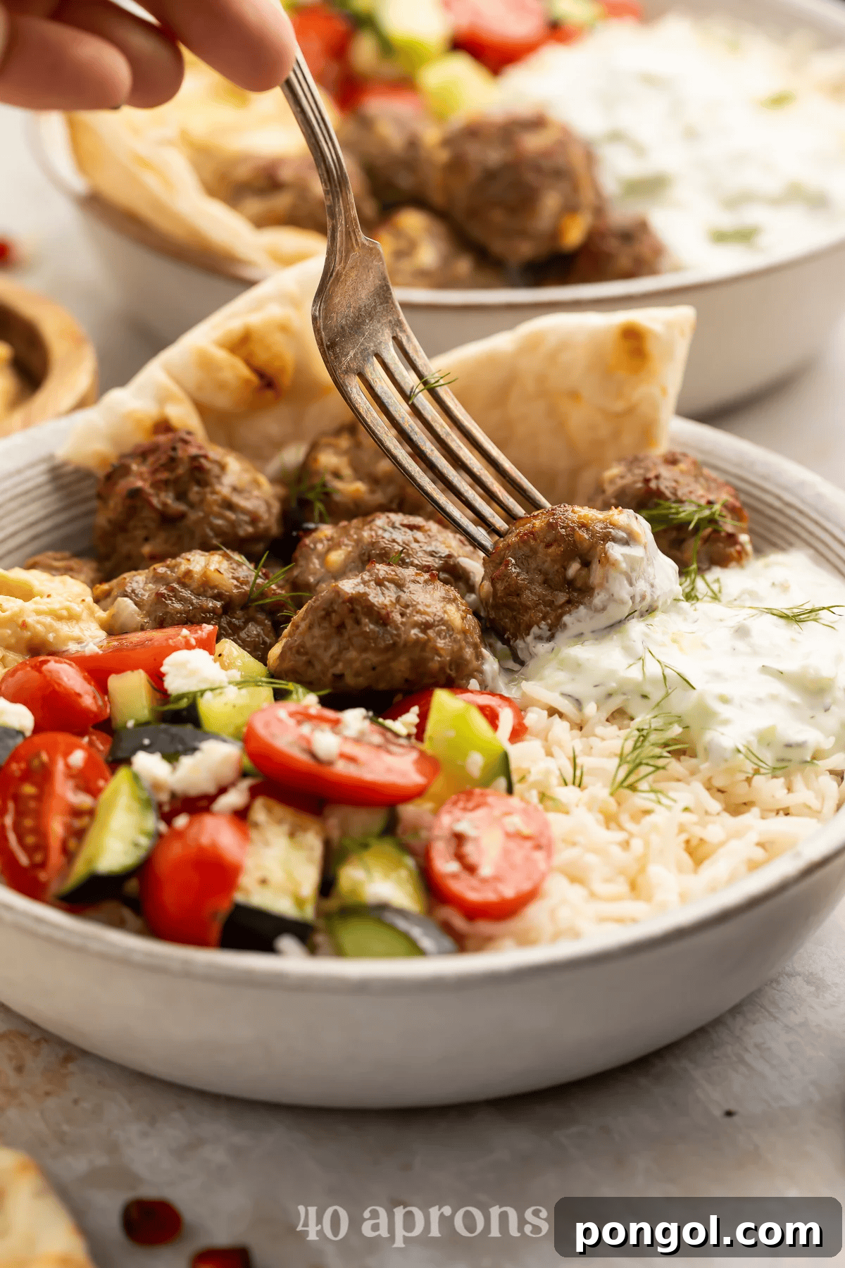 Gyro bowls with lamb meatballs, lemony rice, and tzatziki