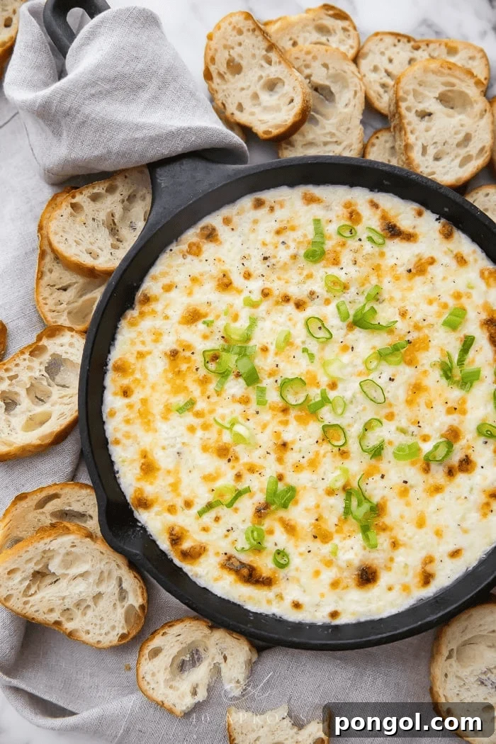 Hot Crab Dip baked until bubbly and golden, served with crackers
