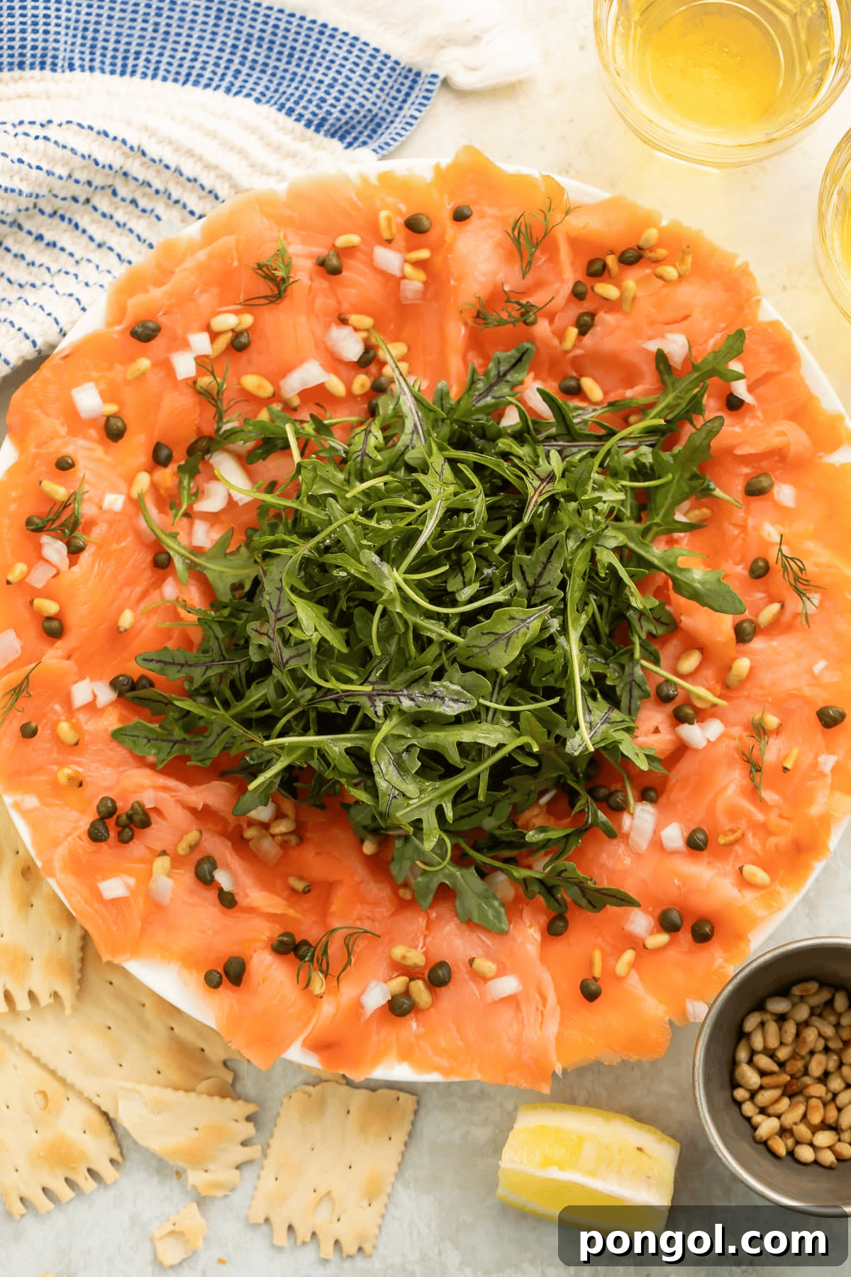 Smoked Salmon Carpaccio with olive oil, lemon, capers, and pine nuts