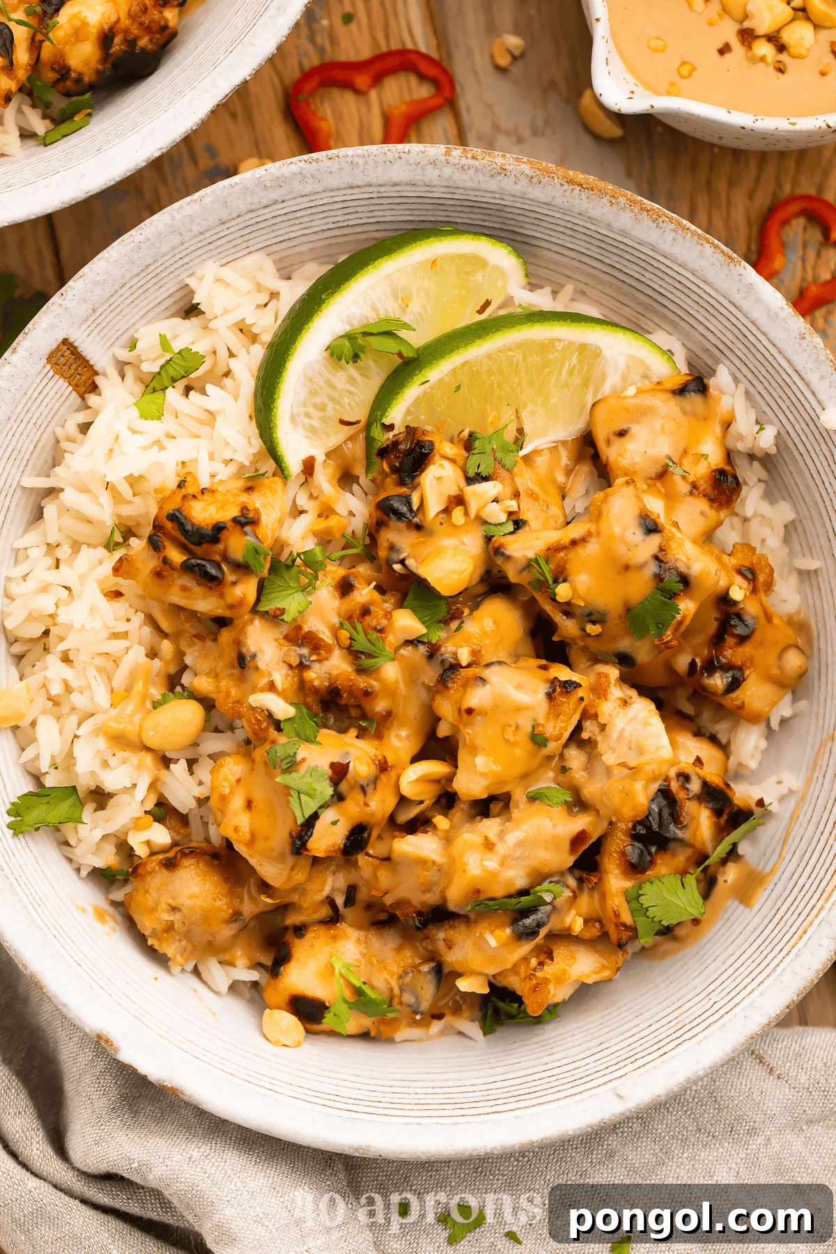 Thai Peanut Chicken skewers served over rice
