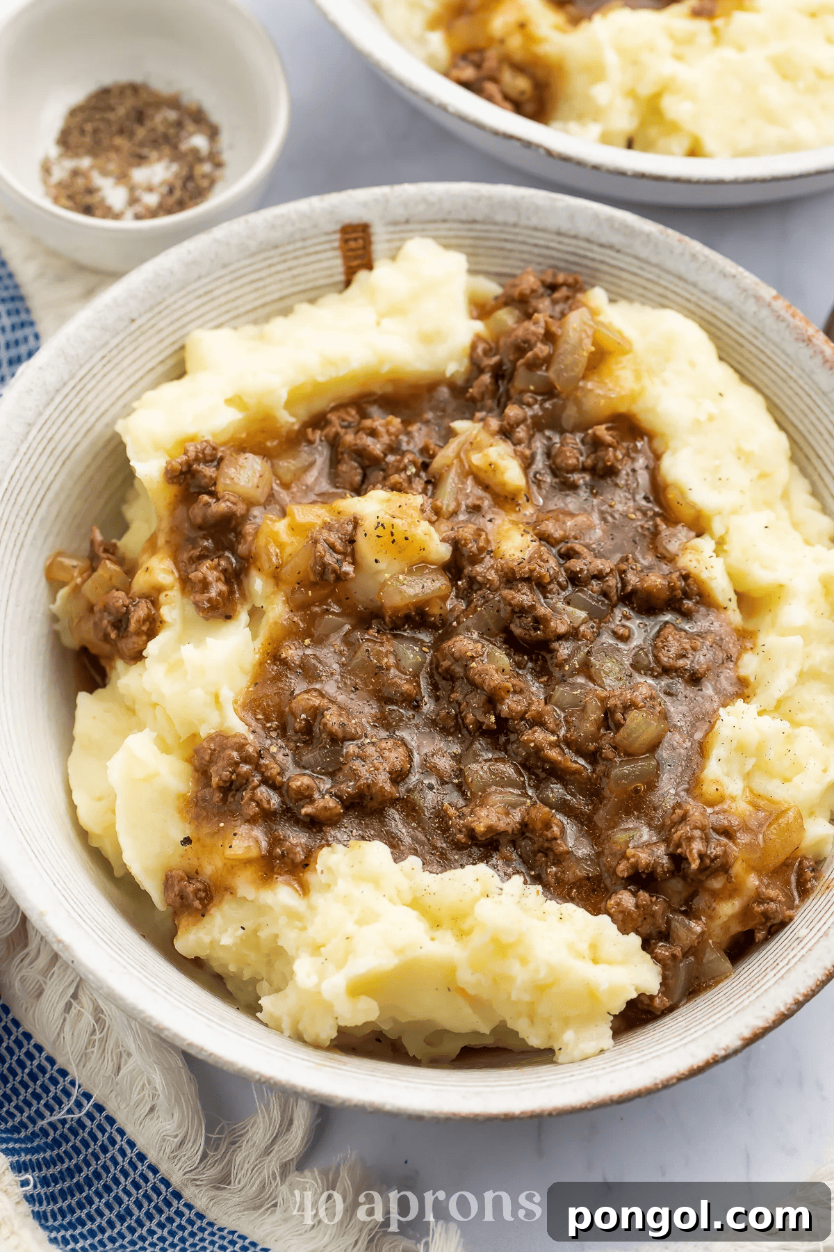 Ground beef gravy served over creamy mashed potatoes