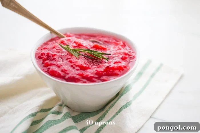 This Instant Pot Whole30 cranberry sauce with apples and rosemary is the perfect Whole30 cranberry sauce: sweet and tart with no added sweeteners at all! It's the perfect addition to any Whole30 Thanksgiving table and goes beautifully with my Whole30 green bean casserole. You'll love this Instant Pot Whole30 cranberry sauce with apples and rosemary because it's so easy and quick yet gourmet!