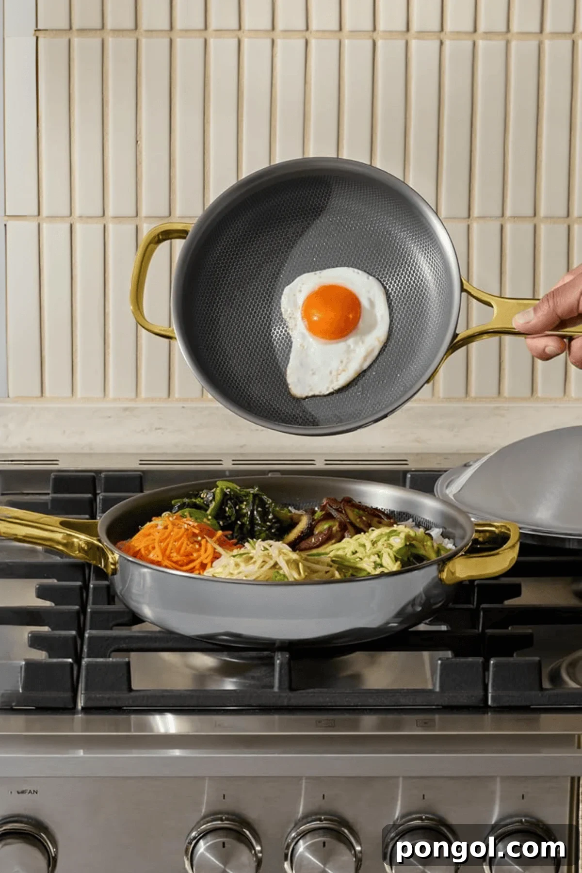 Unveiling 2026s Best Kitchen Innovations and Home Upgrades You Need to See 9 Our Place Titanium Always Pan Pro with gold handles on stovetop cooking fried egg and bibimbap