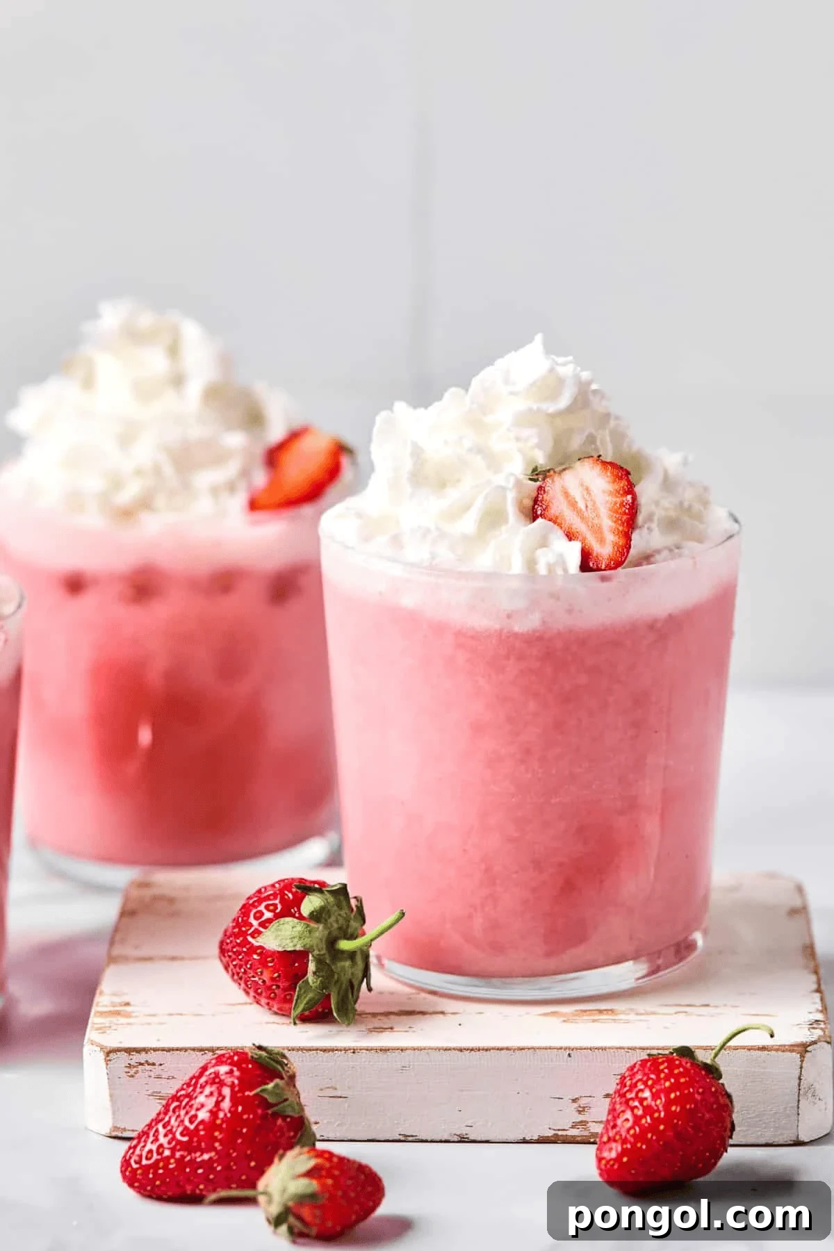 Creamy and refreshing strawberries and cream cocktail with a sugared rim, perfect for Valentine's Day celebrations