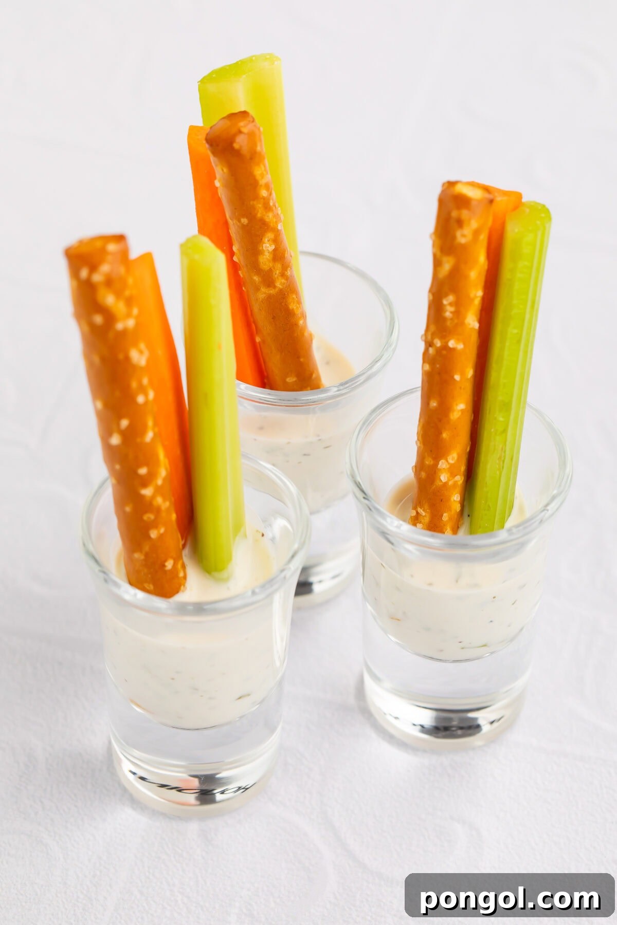 Little Loves' Valentine's Day Feast 5 Elegant Valentine's crudités served in a shot glass with ranch dip, carrot and celery sticks, and a breadstick, with a ranch drizzle on the side