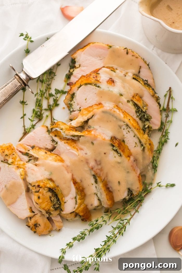 Golden brown roasted turkey breast ready to be carved