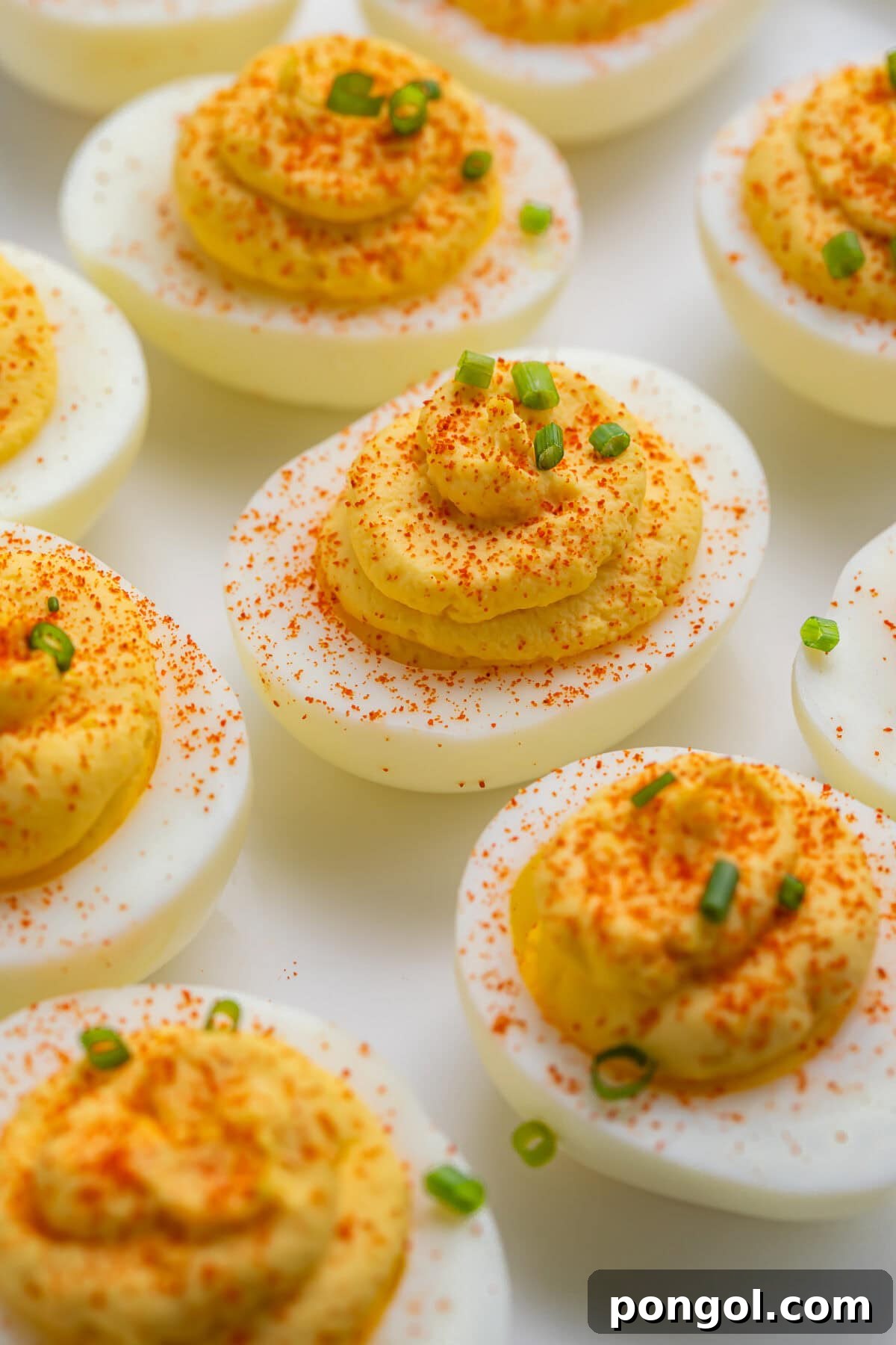 Easter Feasts Gifts and Fun Your Complete Celebration Guide 9 A platter of classic deviled eggs, garnished with paprika and parsley, perfect for a traditional Easter gathering.