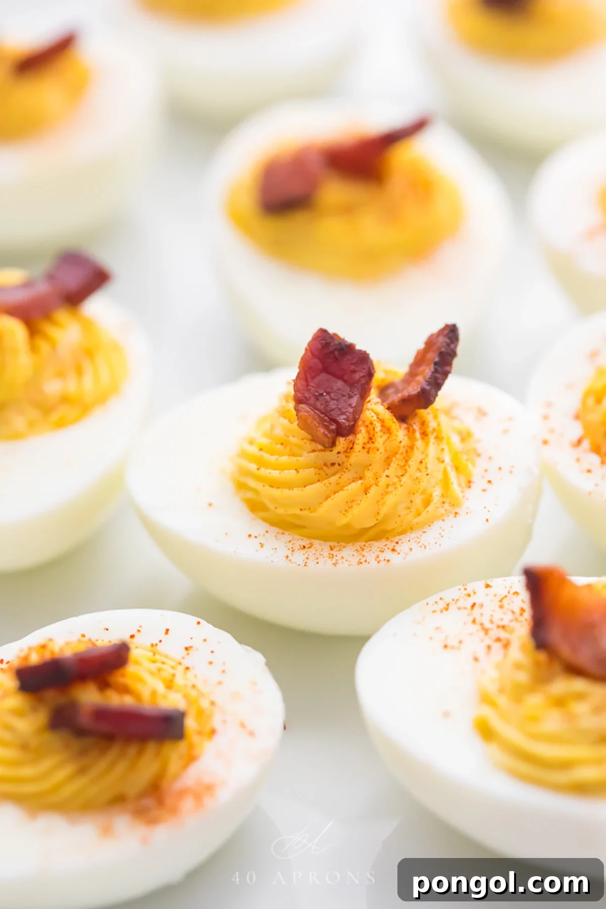 Easter Feasts Gifts and Fun Your Complete Celebration Guide 10 Perfect Whole30 deviled eggs with crispy bacon crumbles on top, a delicious and healthy Easter option.