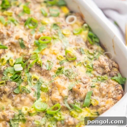 Whole30 sausage, egg, and hashbrown breakfast casserole in a casserole dish.