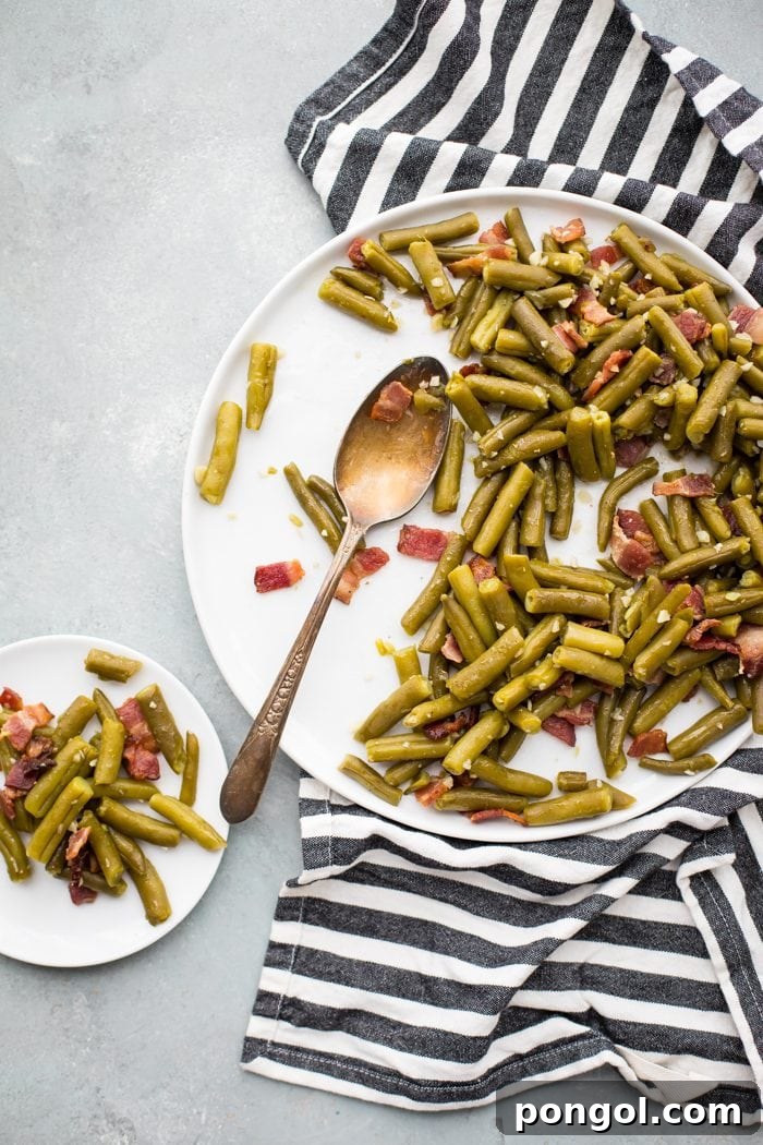 Whole30 Del Monte green beans with bacon in a white dish