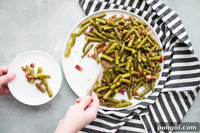 Whole30 Del Monte green beans with bacon in a white dish