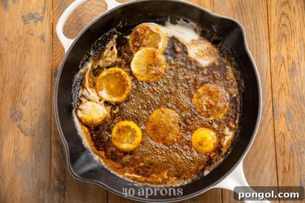Big Easy BBQ Shrimp Po Boy 4 Overhead view of butter sauce ingredients for bbq shrimp po-boy in a large skillet.