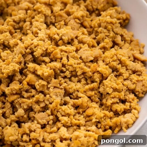 A bowl of crumbled ground beef made from seitan.