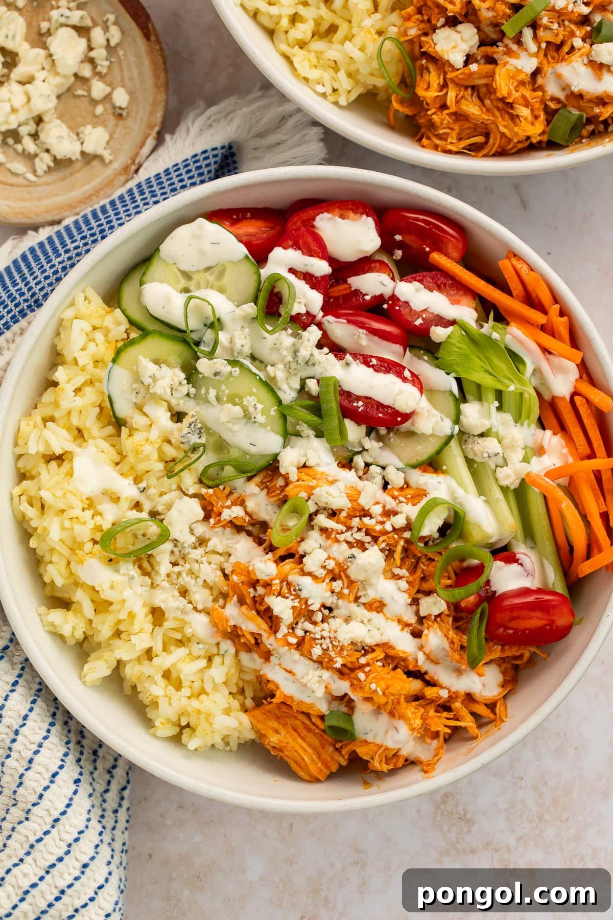 Close-up of Instant Pot shredded buffalo chicken with visible texture and sauce coating