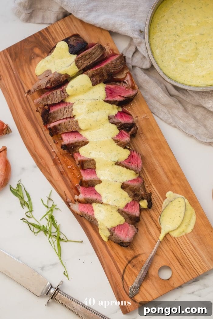 Medium-rare Whole30 steak with Whole30 bearnaise sauce in a dish