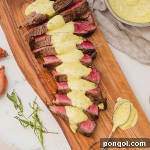 Medium-rare Whole30 steak with Whole30 béarnaise sauce in a dish