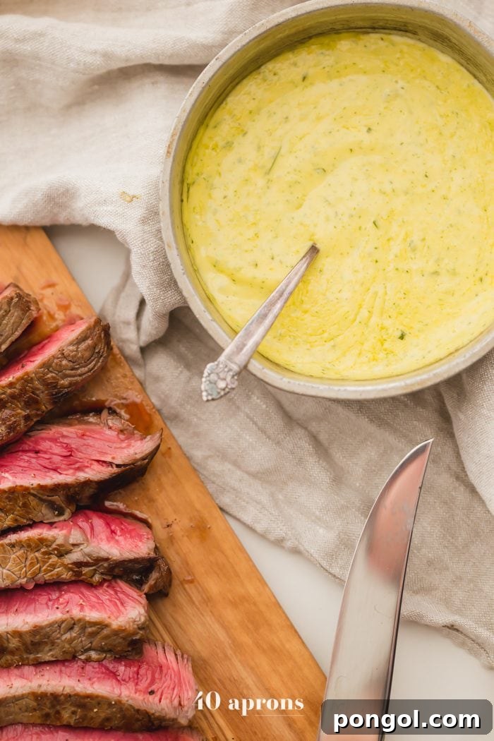 Medium-rare Whole30 steak with Whole30 béarnaise sauce in a dish
