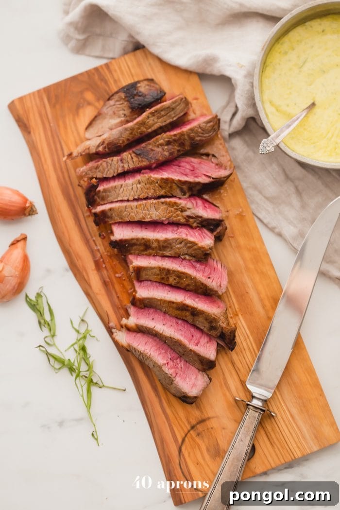 Medium-rare Whole30 steak with Whole30 béarnaise sauce in a dish