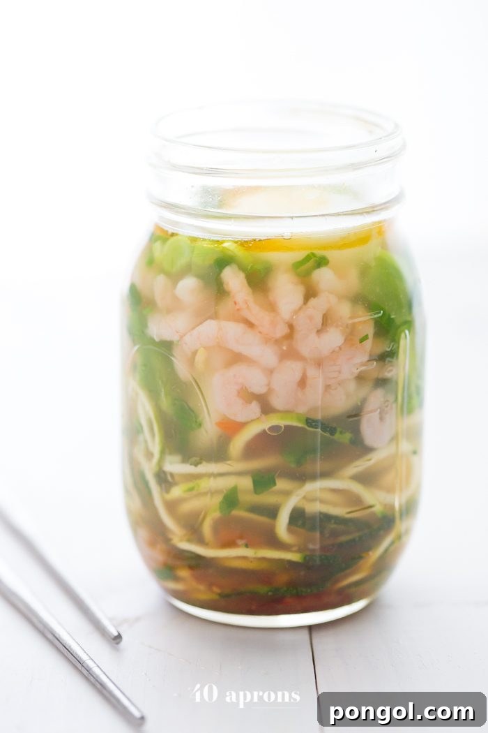 Whole30 Paleo Zoodle Cups 3 Whole30 snack cup zoodles: zucchini noodles with vegetables and shrimp in a mason jar ready to be prepared for a healthy lunch or snack.