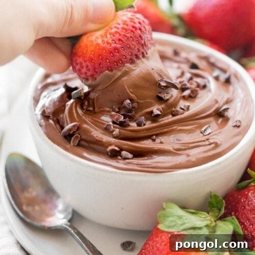 Paleo chocolate mousse dip with strawberry