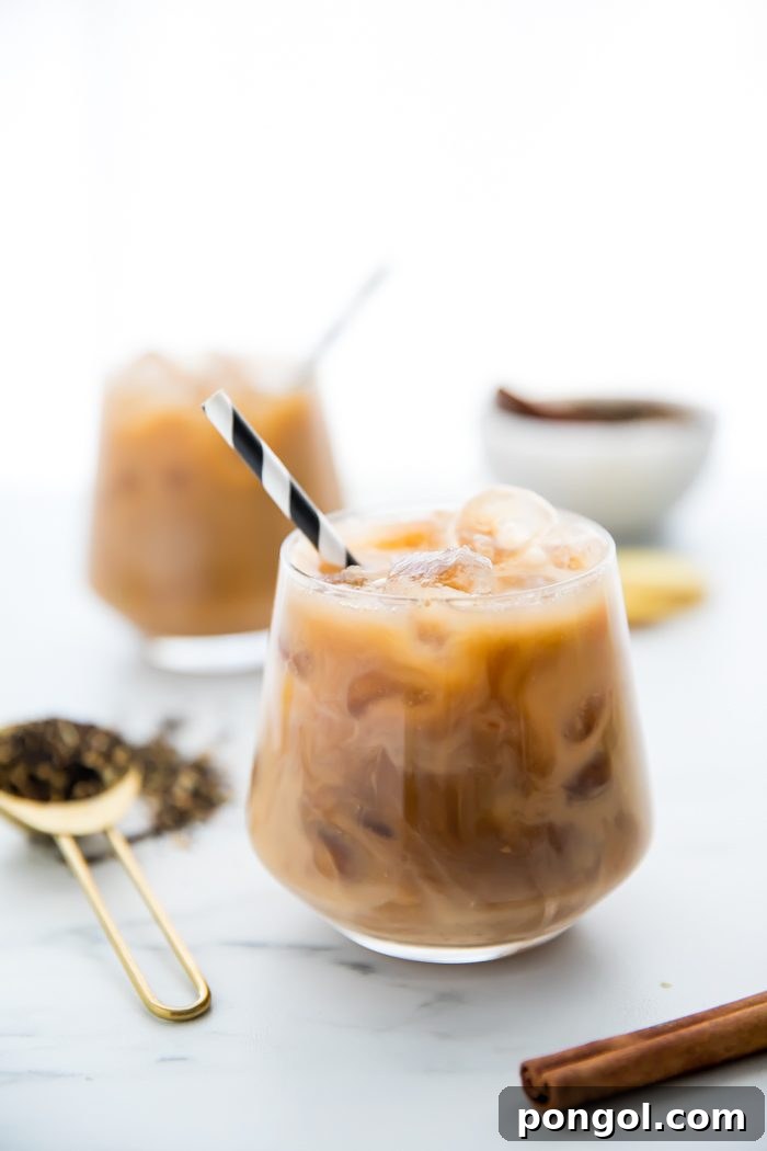 Iced Dirty Chai, Elevated: Vegan, Paleo, Sugar-Free Goodness 3 Close-up of a glass of Iced Dirty Chai with ice and Wholesome Organic Stevia packet nearby.