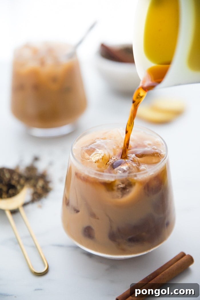 Iced Dirty Chai, Elevated: Vegan, Paleo, Sugar-Free Goodness 5 Cold brew coffee being poured into an iced dirty chai.