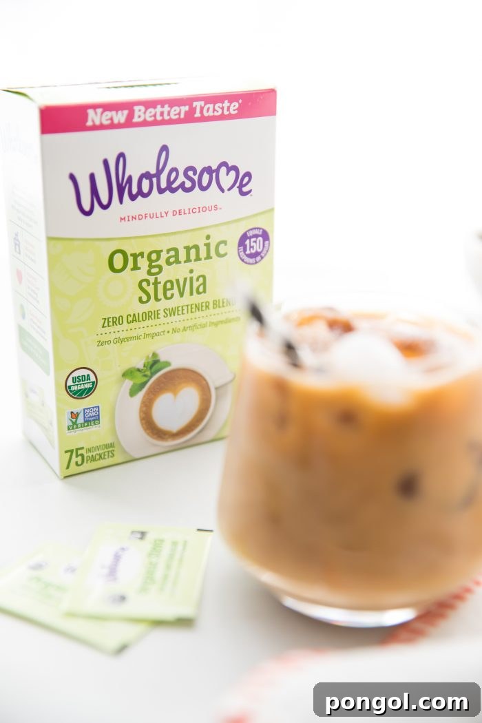 Iced Dirty Chai, Elevated: Vegan, Paleo, Sugar-Free Goodness 6 Two glasses of Iced Dirty Chai with Wholesome Organic Stevia packets on a wooden surface.