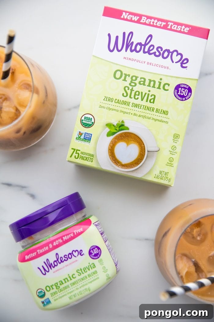 Iced Dirty Chai, Elevated: Vegan, Paleo, Sugar-Free Goodness 7 Multiple iced dirty chai lattes with ice and stevia packets, on a rustic background.