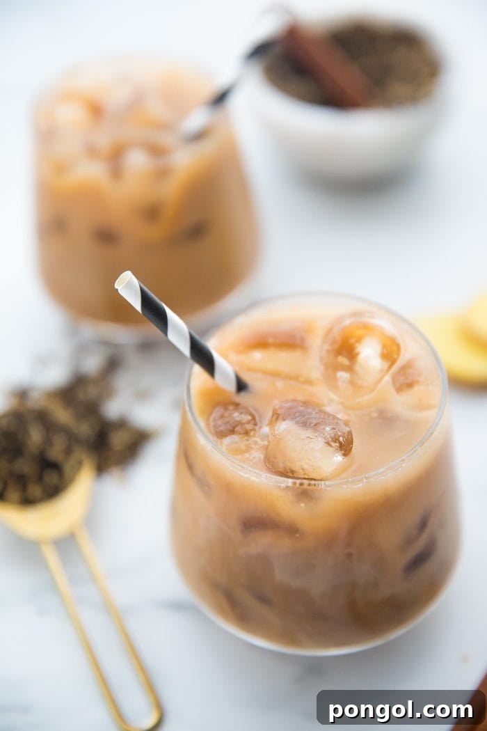 Iced Dirty Chai, Elevated: Vegan, Paleo, Sugar-Free Goodness 8 Single glass of Iced Dirty Chai with a straw, garnished with a star anise.