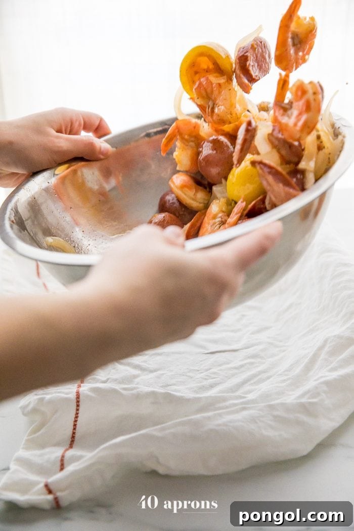 Whole30 Paleo Garlic Ghee Shrimp Boil with Sausage and Potatoes 6 A close-up of the Whole30 shrimp boil, showcasing the rich colors and textures of the seasoned shrimp, sausage, and potatoes, all tossed in fragrant garlic ghee