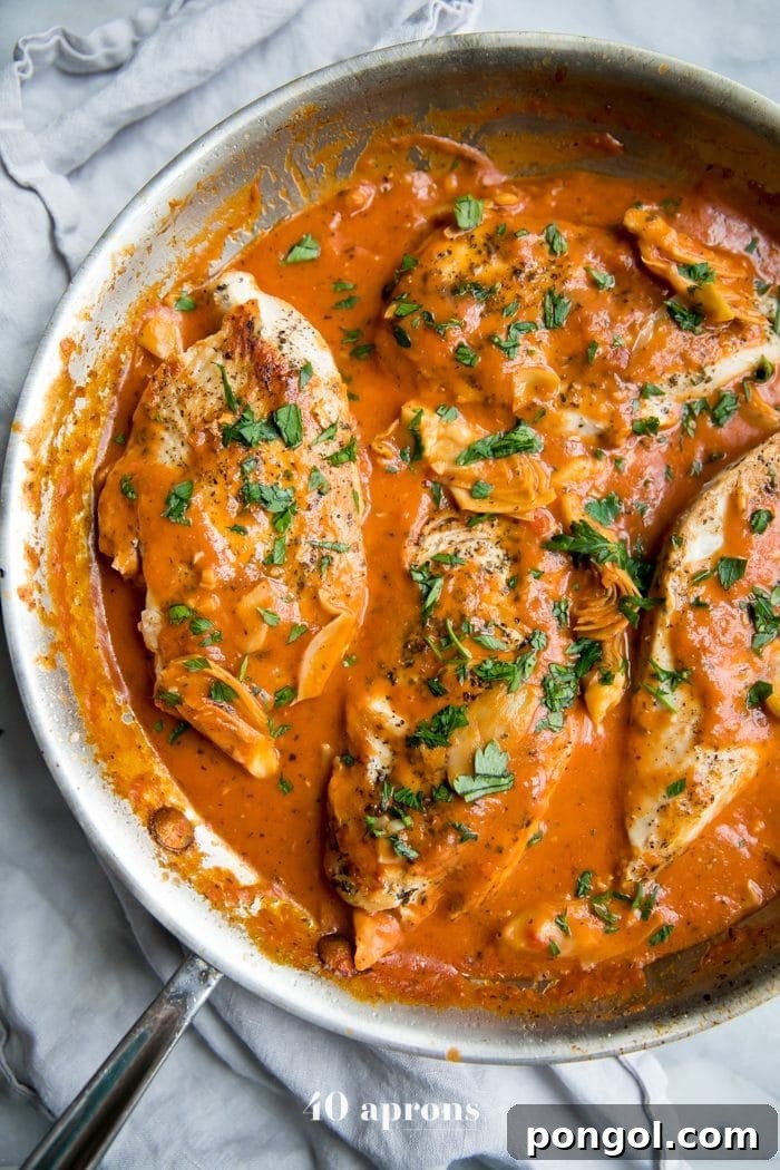 Creamy tomato artichoke chicken (Whole30, paleo) in a skillet