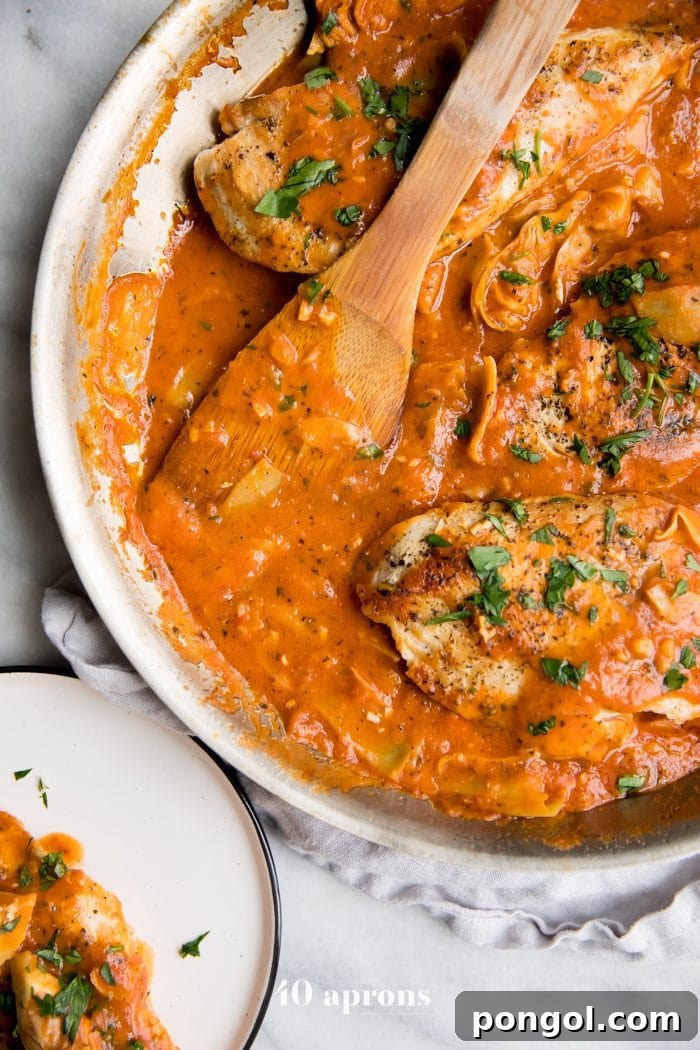 Creamy tomato artichoke chicken (Whole30, paleo) in a skillet