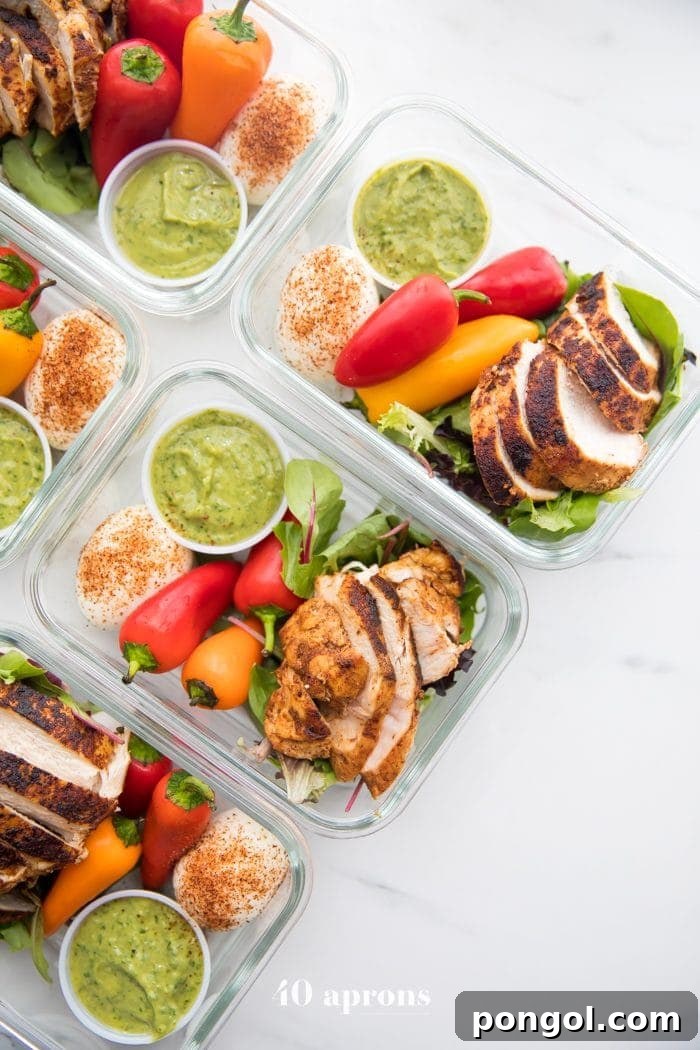 Containers of healthy Mexican chicken meal prep, showcasing vibrant colors and fresh ingredients