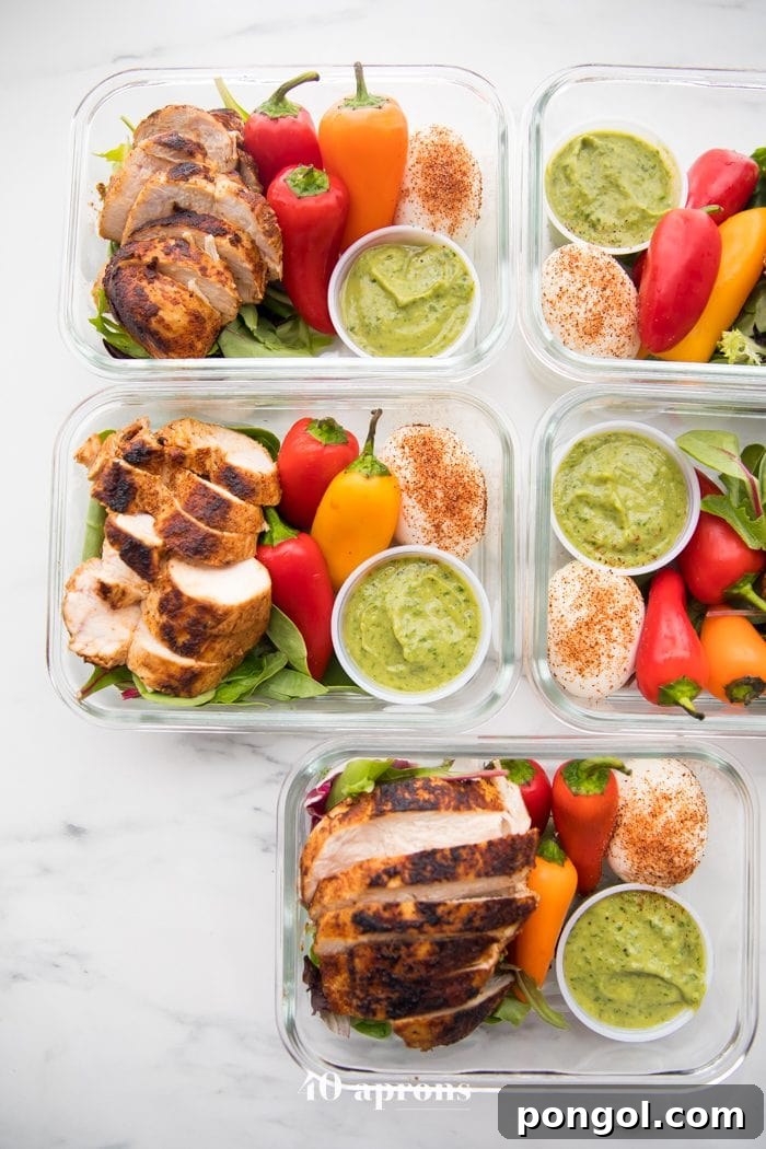Multiple containers of healthy Mexican chicken meal prep on display