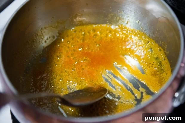 Sweet & Smoky Orange Glazed Zucchini (Paleo, Gluten Free) 5 orange glaze bubbling away to reduce in a pot