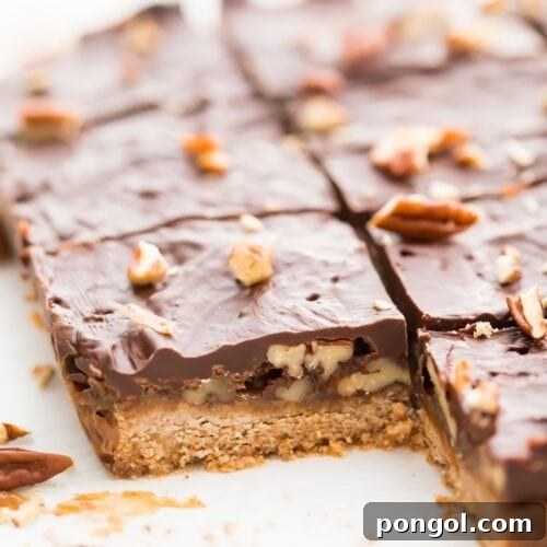 Batch of healthy paleo and vegan turtle bars on parchment paper