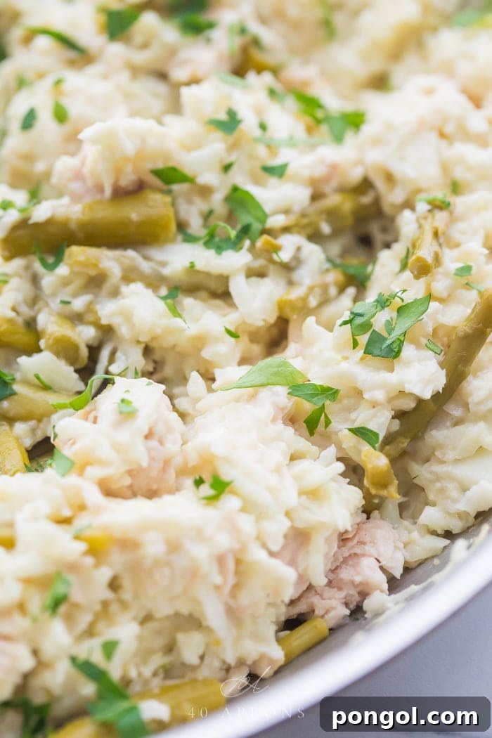 Close up shot of quick Whole30 cauliflower risotto with chicken and asparagus