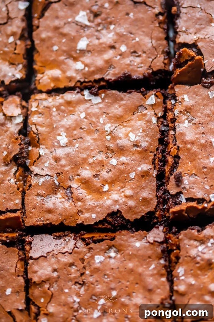 Ultimate Fudgy Crackly Paleo Brownies Gluten Free 5 An up-close shot of the crunchy top on these perfect gluten free brownies, topped with flake sea salt