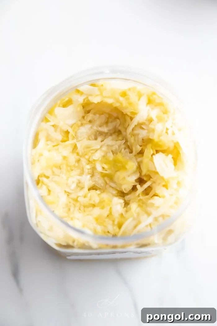 An overhead shot of a container of plain sauerkraut, indicating the source of the secret ingredient.