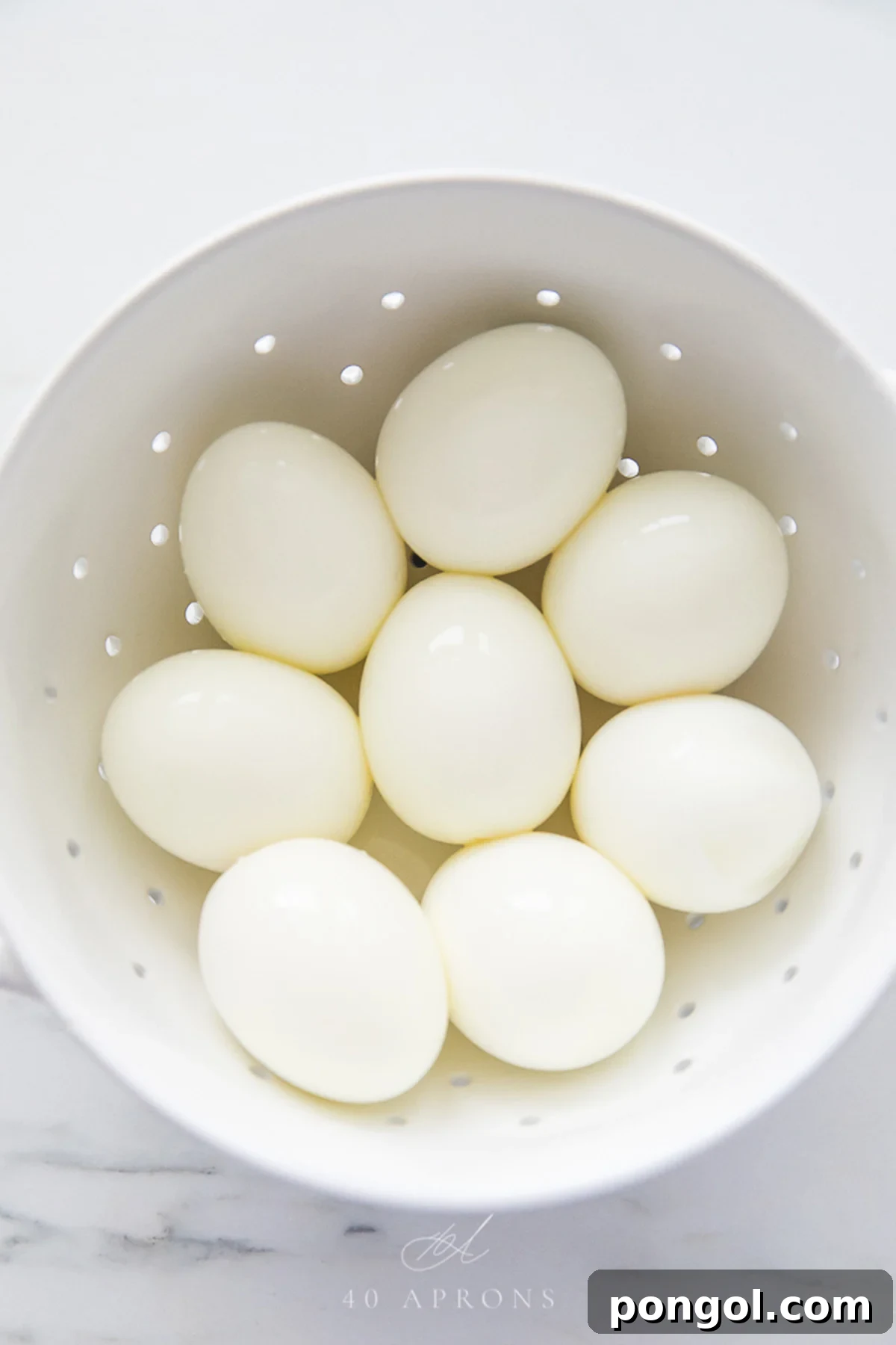 A bowl of perfect peeled soft and hard boiled eggs.