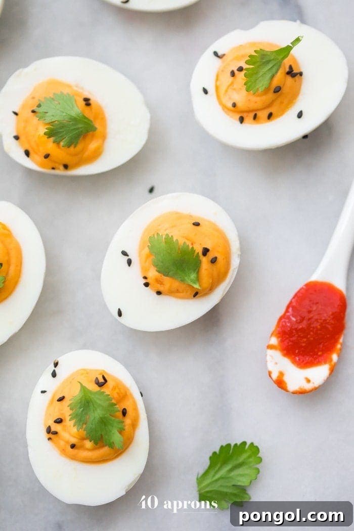 Creamy Sriracha Deviled Eggs with a hint of spice