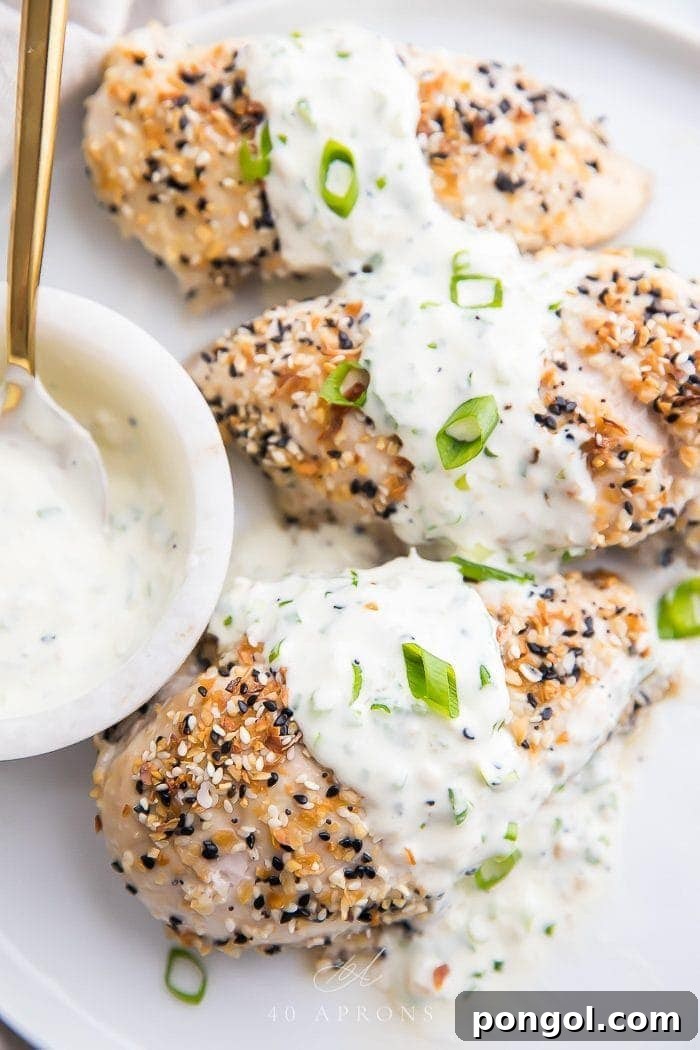 Chicken with everything bagel seasoning topped with scallion cream cheese sauce