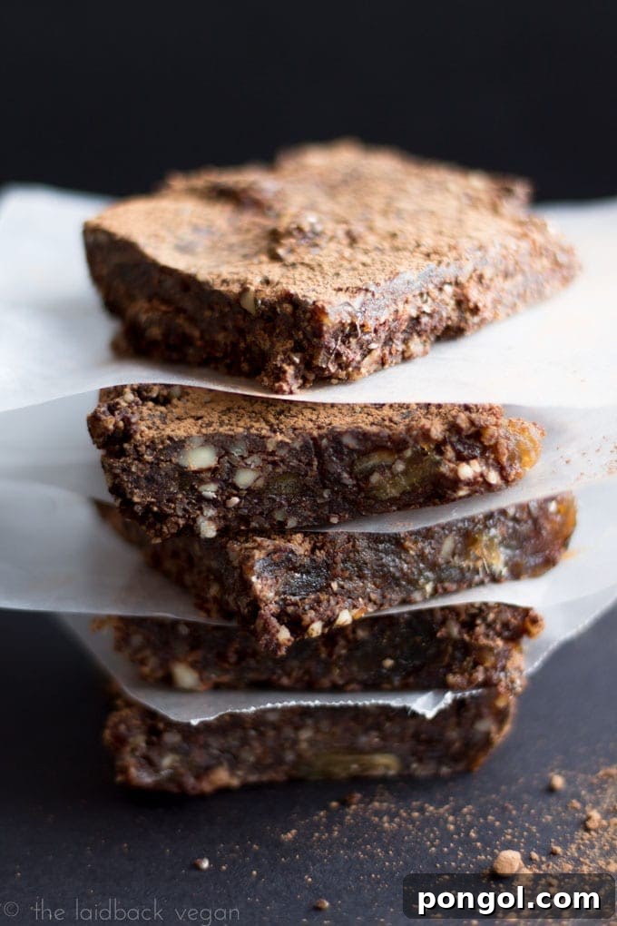 Fudgy No-Bake Brownies 2 Stacked Raw Vegan Gluten-Free Brownies, showcasing their dense, fudgy texture